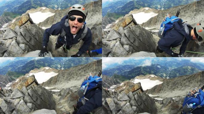 男人正在爬到山顶
