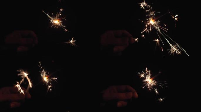 烟火烟火燃烧的特写镜头。烟花在黑色背景上燃烧。慢动作镜头