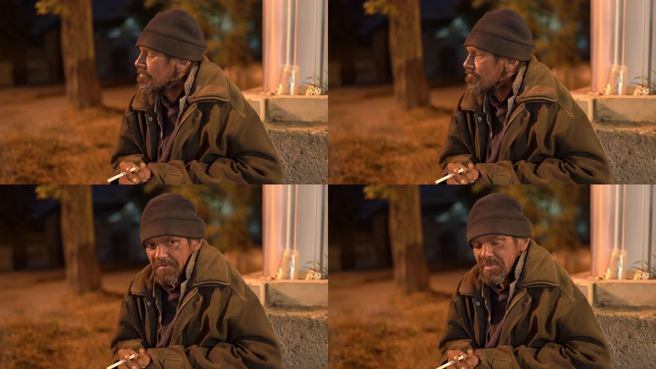 无家可归的病人晚上在街上抽烟。