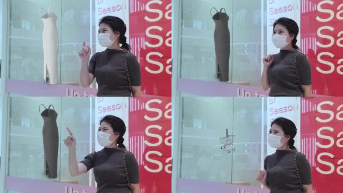 未来智能零售技术概念。在商店中使用增强混合虚拟现实技术的面具客户，并尝试选择布料的颜色并在新型冠状病