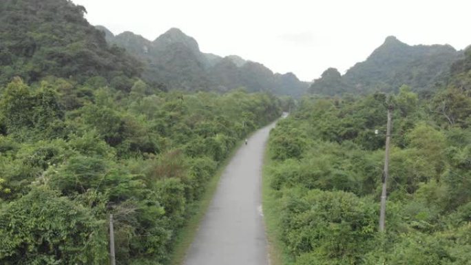 空中: 女子骑踏板车内陆猫巴岛，越南旅游目的地