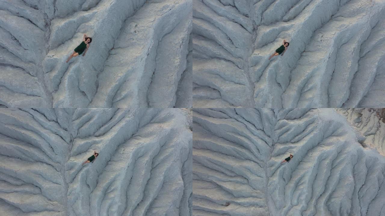 乌克兰躺在白色白垩沙丘上的妇女的鸟瞰图