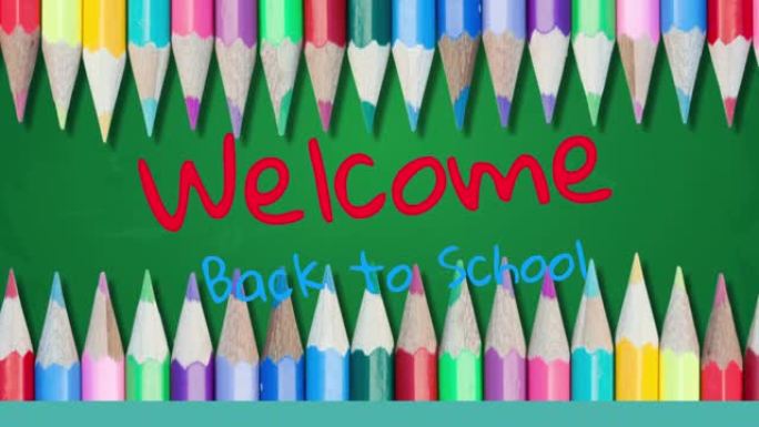 欢迎回到学校文本反对绿色背景上的彩色铅笔