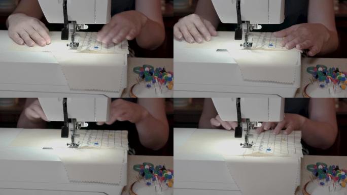运动中的缝纫机。在缝纫车间，裁缝缝制浅色织物，制作精美的刺绣