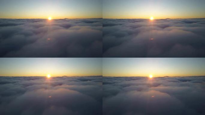 日落时分，黎明时分，坐飞机在云层上方飞行。