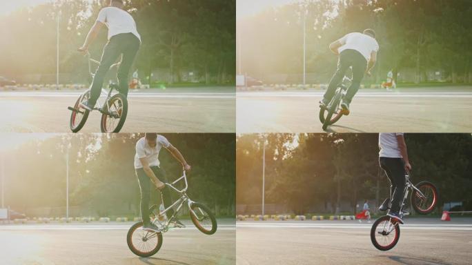 穿着休闲装的年轻男性正在骑bmx自行车，在空中在其轴上跳跃和旋转，在停车场上做戏