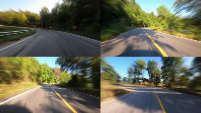 乡村道路上的延时旅行在乡村森林和森林中快速移动速度具有运动模糊效果