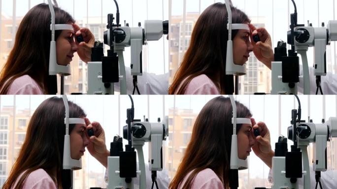 眼科治疗-一名年轻女子检查她的视力-瞳孔对光的反应扔晶状体