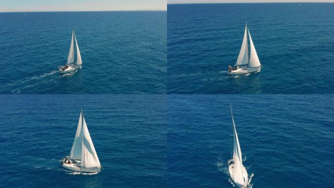 在开阔的海面上航行的游艇。帆船。游艇视频。从上面看游艇。在大风天游艇。游艇。帆船