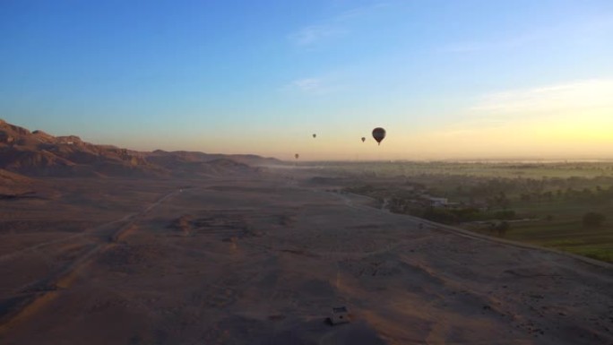 乘坐热气球在卢克索埃及山谷上的空中视频运动联合国教科文组织遗产地日出