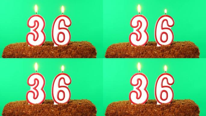 36号点燃蜡烛的蛋糕。色度键。绿屏。隔离