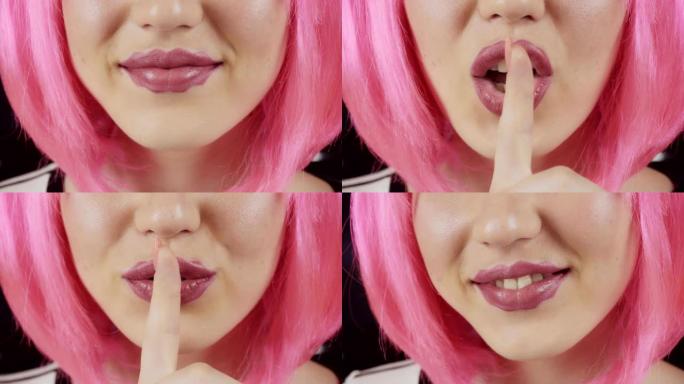 有魔鬼嘴唇的女孩。年轻漂亮的粉红色头发女孩。