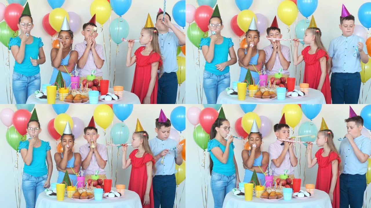 孩子们在餐桌上庆祝生日的派对喇叭