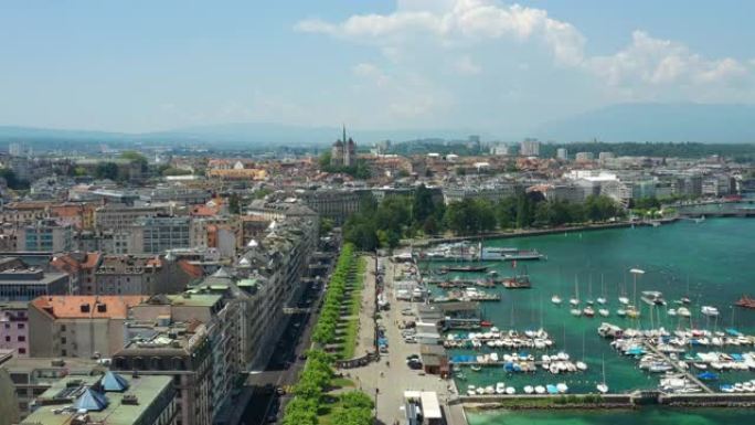 飞越阳光明媚的日内瓦城著名的湖边步行公园湾空中全景4k瑞士