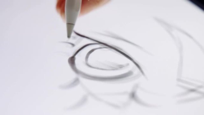 数字笔在图形平板电脑上绘制艺术品的特写