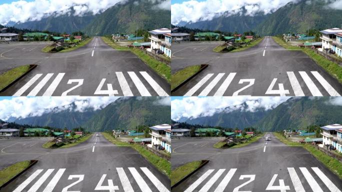4K UHD镜头，双引擎短程飞机降落在尼泊尔卢克拉世界上最危险的机场跑道上。Tenzing-希拉里机