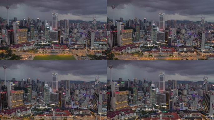 吉隆坡城市宫殿市中心背景黄昏照明风暴天空交通空中全景4k马来西亚