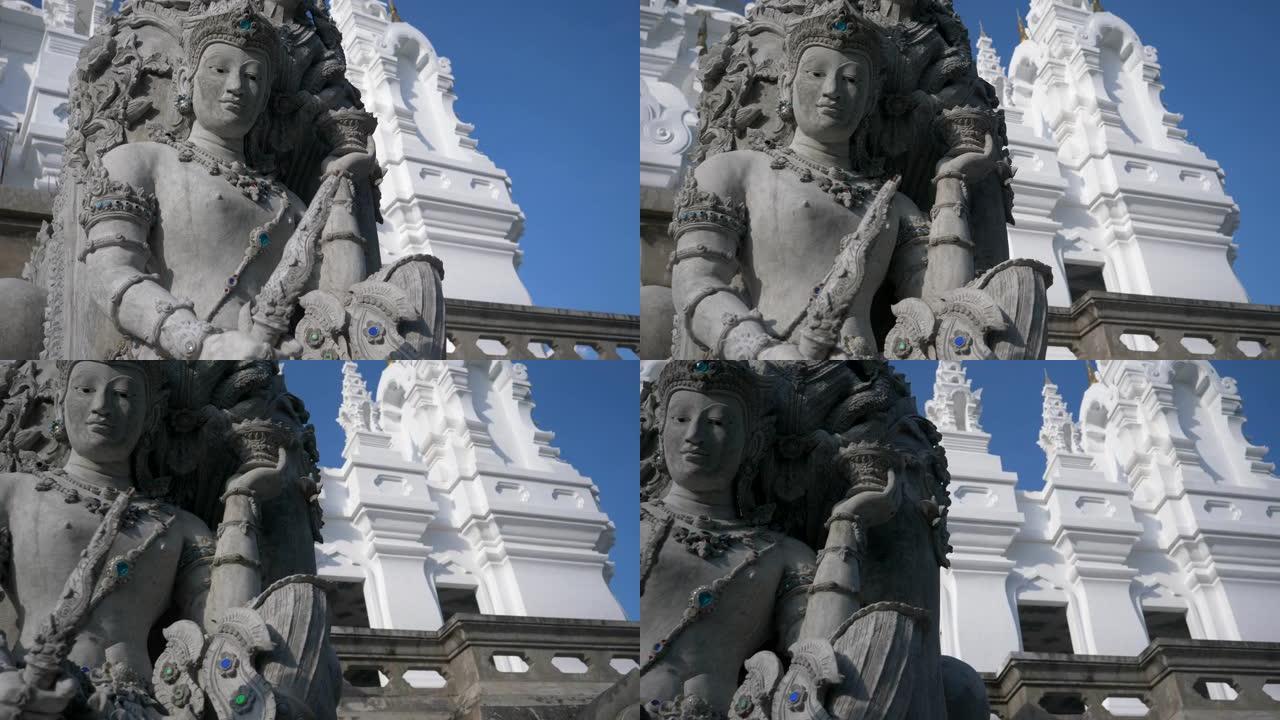 白色寺庙上详细雕像的低角度特写
