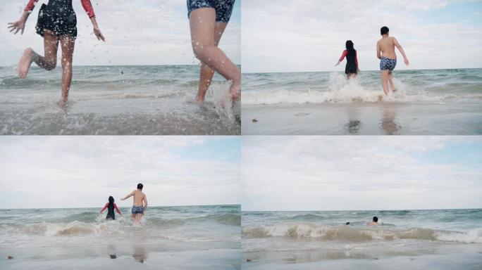 度假期间，快乐的亚洲儿童在华欣海滩跑步。