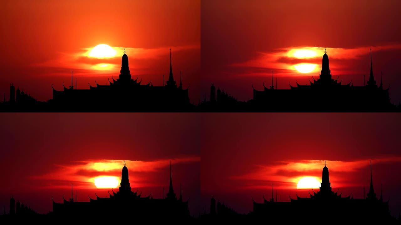 红色天空上的日落背云和经过柔和的云和剪影神庙