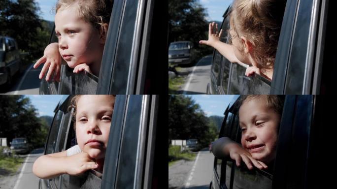 快乐可爱的小女孩带着微笑伸出车窗迎风。慢动作V3