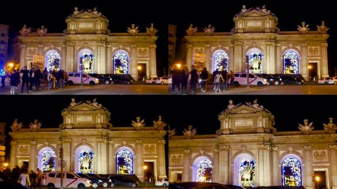 马德里著名的阿尔卡拉广场 (Puerta de Alcala) 在圣诞节期间被游客和汽车流通所包围