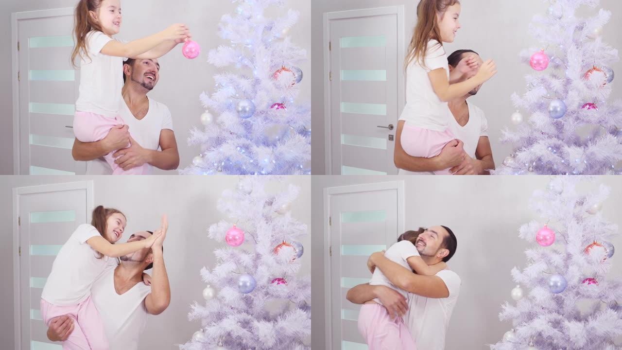 小女儿想把粉红色的小玩意挂在树的顶枝上，所以父亲把她抱起来，孩子做她想做的事，他们给了五个满意的手势