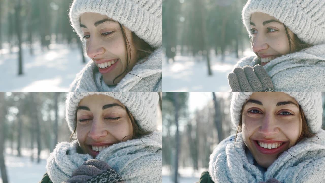在寒冷的晴天，白雪皑皑的冬季公园里，穿着羊毛帽子和长保暖围巾的美丽微笑女人的极端特写肖像
