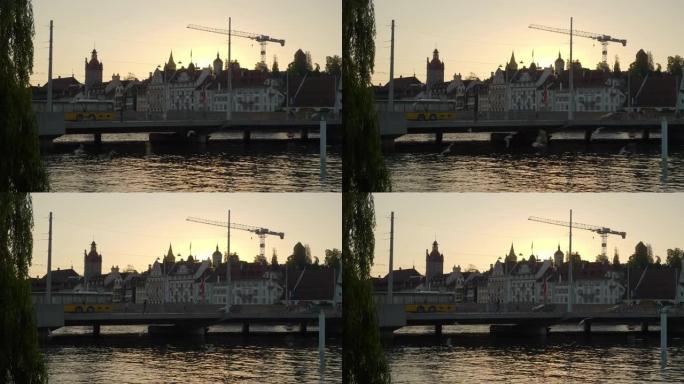 日落时间卢塞恩市交通河滨大桥慢动作全景4k瑞士
