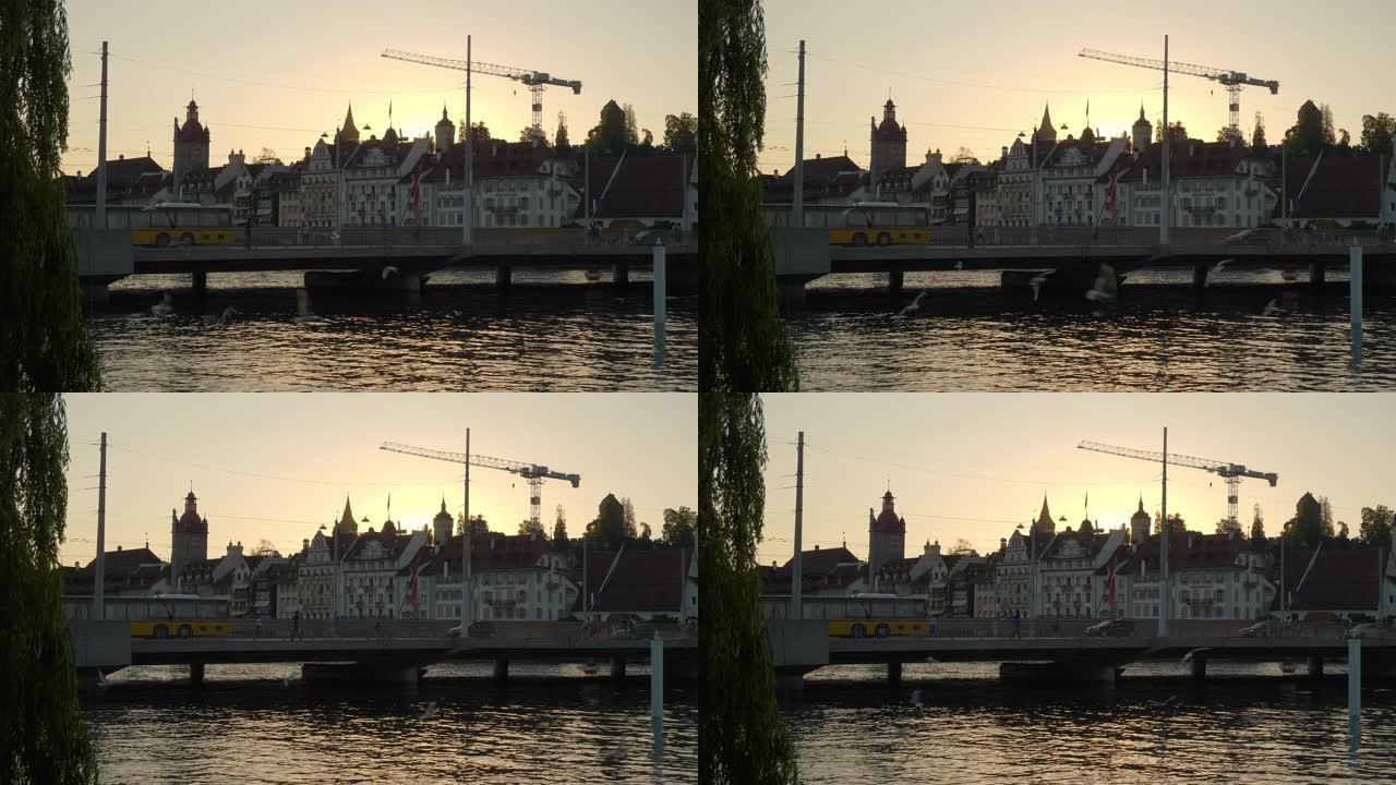 日落时间卢塞恩市交通河滨大桥慢动作全景4k瑞士