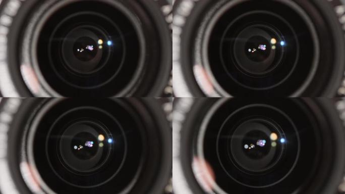 拍照前调整他的专业摄影相机的光圈特写。特写