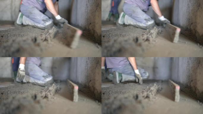 抹刀工作以使混凝土地面光滑。混凝土地面平整