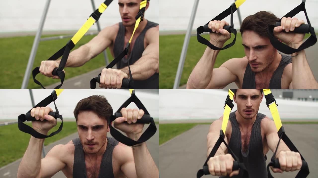 特写男子用trx健身绳锻炼。用吊绳训练的家伙