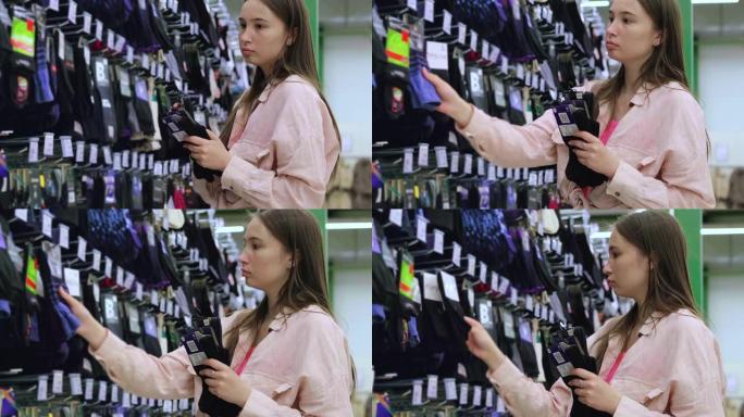 年轻女子正在超市购买袜子