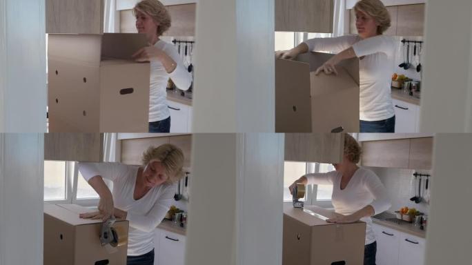 一名妇女正在制作一种新的纸板箱，她将纸板箱的边折起来，然后用胶带封好