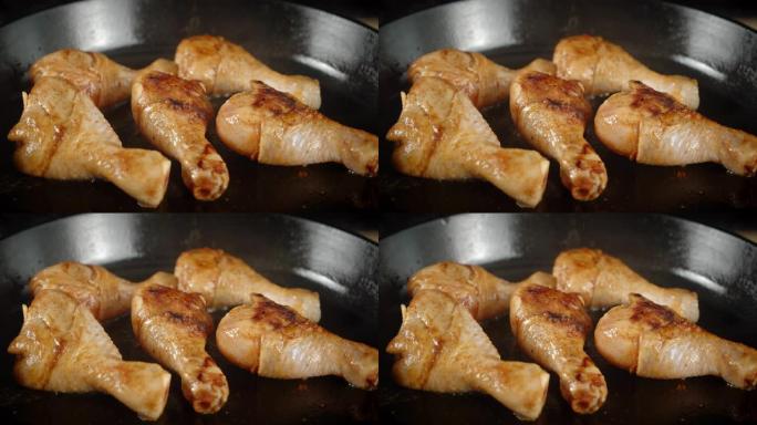 在沸腾的油中，用热蒸汽炸鸡腿。