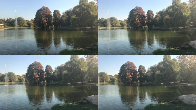 七彩公园里的池塘水倒影慢锅视频