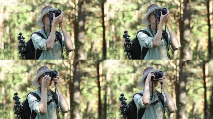 女摄影师在森林中使用模拟胶片相机拍摄自然照片