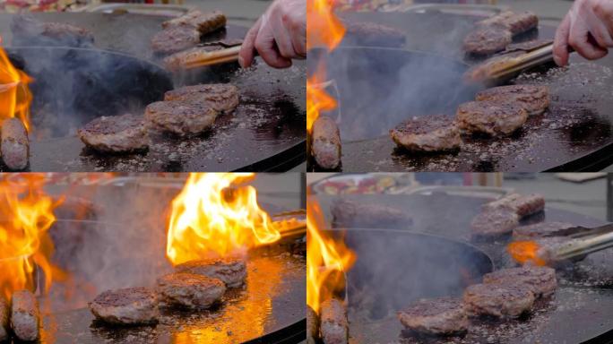 慢动作: 厨师用热火焰在火盆上烤汉堡肉排