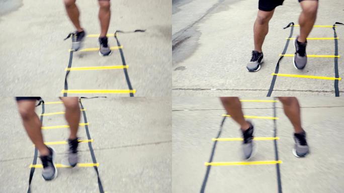 特写腿亚洲男子跑步者用敏捷梯子设备训练。