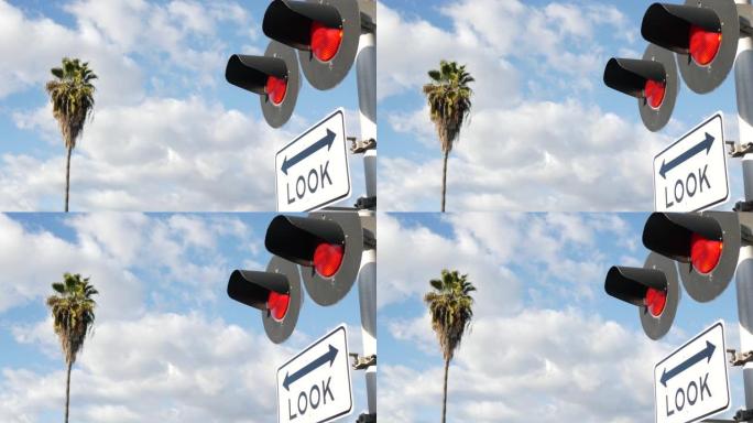 美国的平交道口警告信号。加利福尼亚州铁路交叉口的Crossbuck通知和红色交通信号灯。铁路运输安全