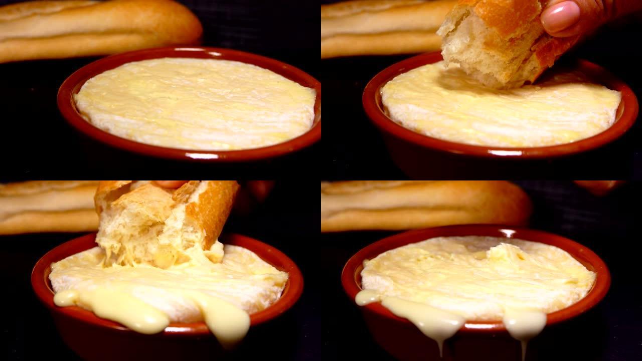 浸在热的柔软的圣费利西安奶酪法棍