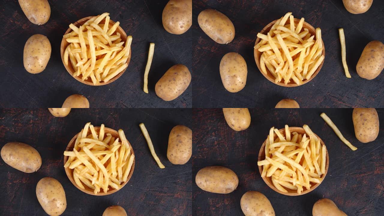 用新鲜土豆慢慢旋转的盘子里的薯条。