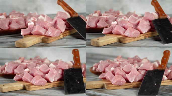 在切菜板上切成薄片的生猪肉烤肉串旋转。