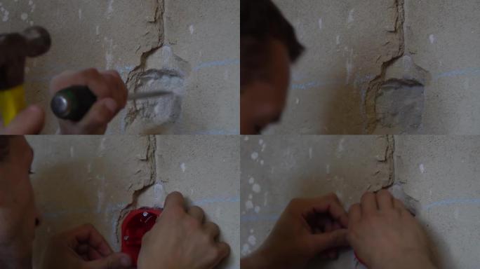 builder打破墙壁上的孔以安装插座，开关，电缆
