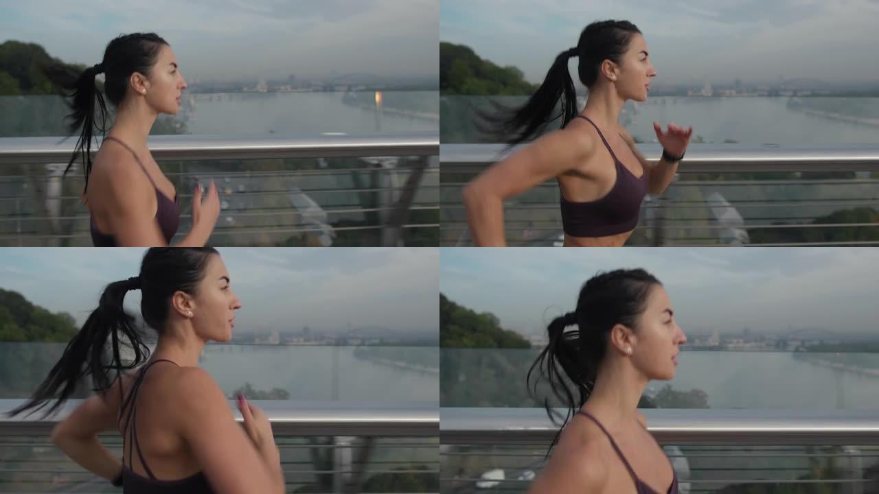 强壮的女运动员在桥上跑得很快。