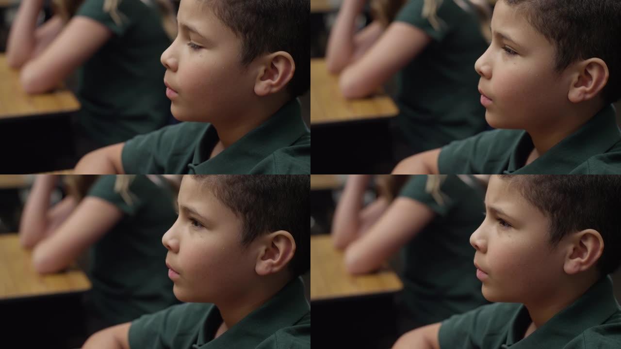 小男孩在课堂上听，少数民族，专心