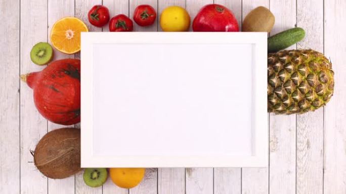 不同的水果和蔬菜出现在白色框架下，有文字的位置。停止运动