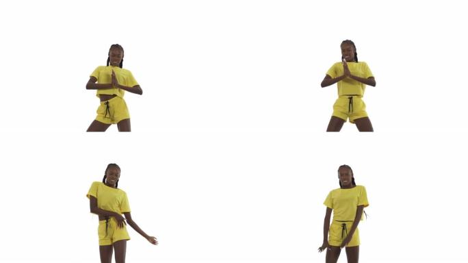 年轻的非洲女子跳舞，展示不同的动作用手，移动臀部。街舞。孤立在白色背景上。