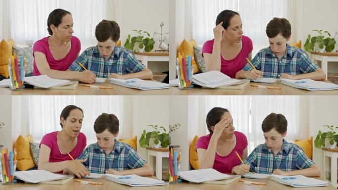 妈妈帮小儿子准备作业